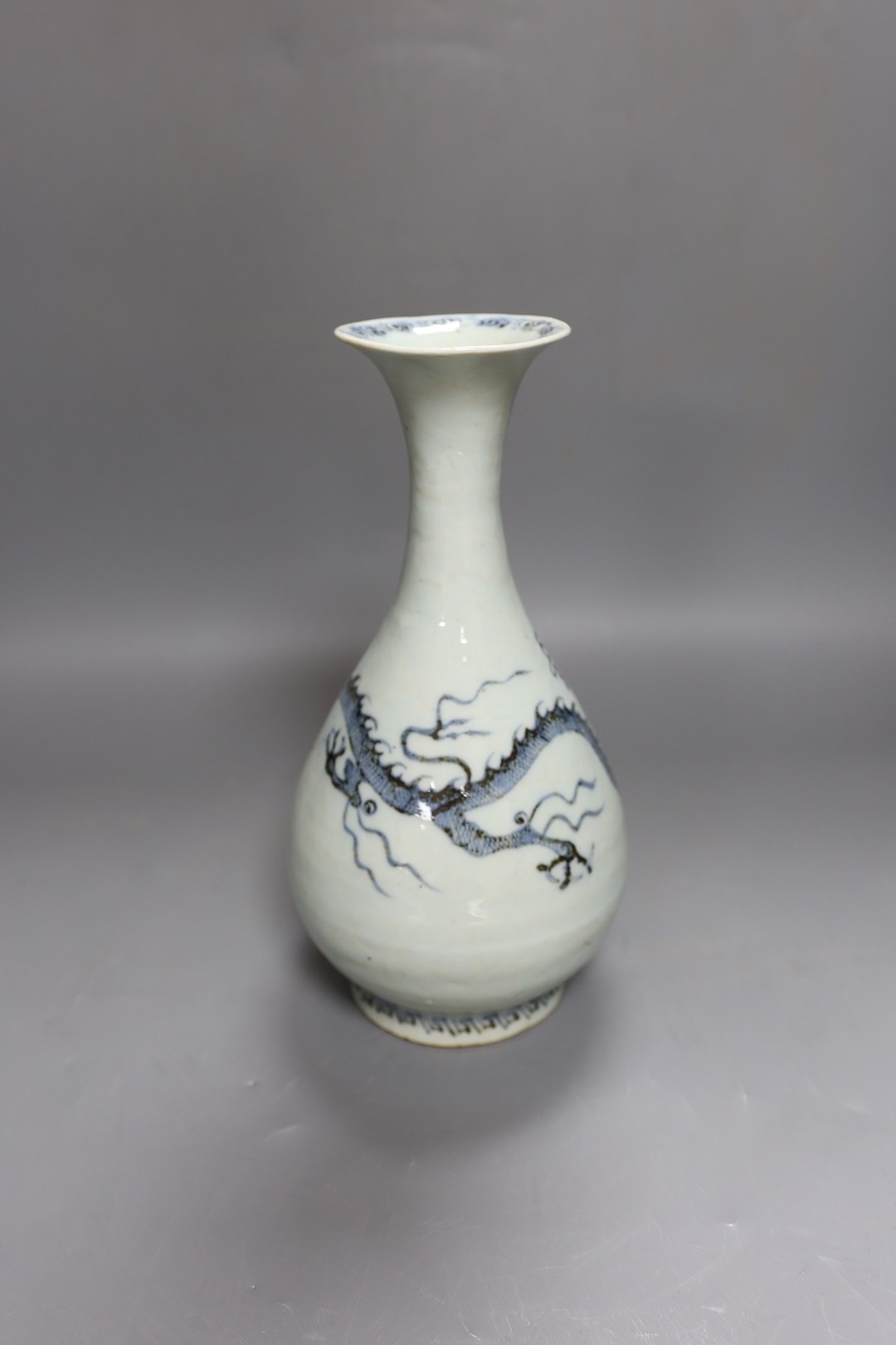 A Chinese blue and white ‘dragon’ bottle vase 25cm